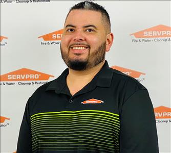 Male, salt and pepper hair, serious face, SERVPRO background